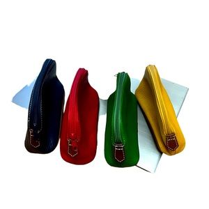 Bundle Four small cosmetic bags red, yellow green and navy blue